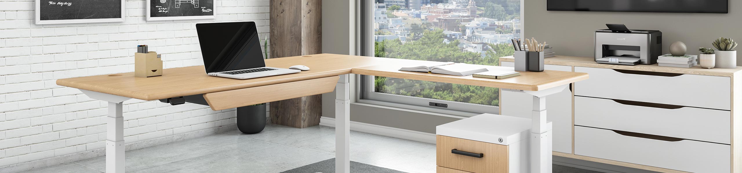 Lander Standing L-Desk in Almond Cherry, with optional Premium Drawer in a home office.