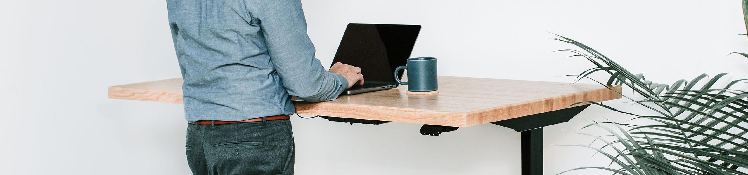 Lander Standing Desk, Oak Butcher Block desktop on Black base.