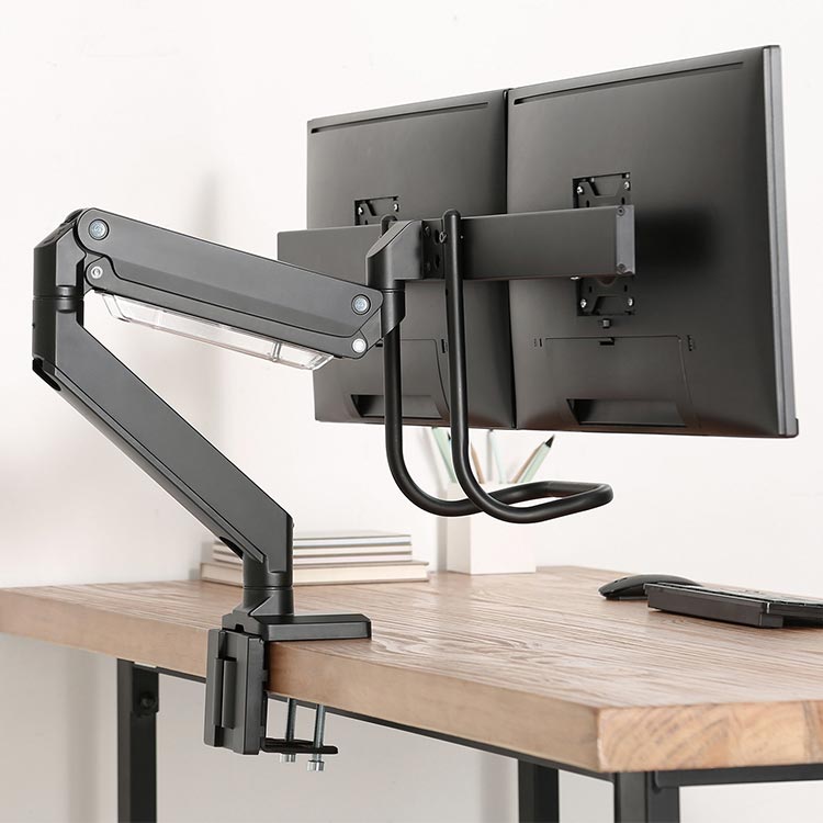 Echo Slide Dual Monitor Arm, black, in use on a butcher block desktop, rear view.