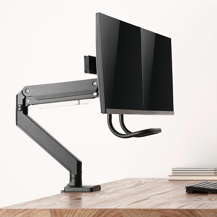 Echo Slide Dual Monitor Arm. black, in use on butcher block desktop, side view.