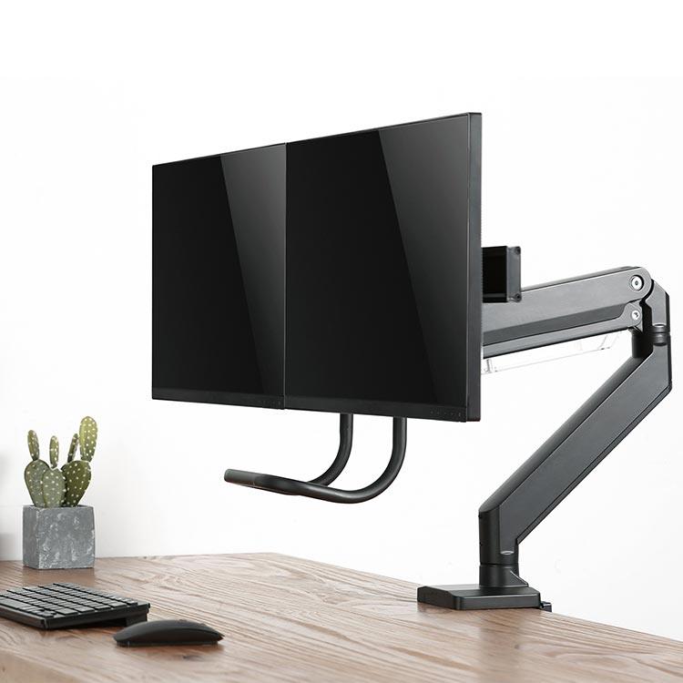 Echo Slide Dual Monitor Arm, black, in use on a butcher block top, shown from a front angle view.