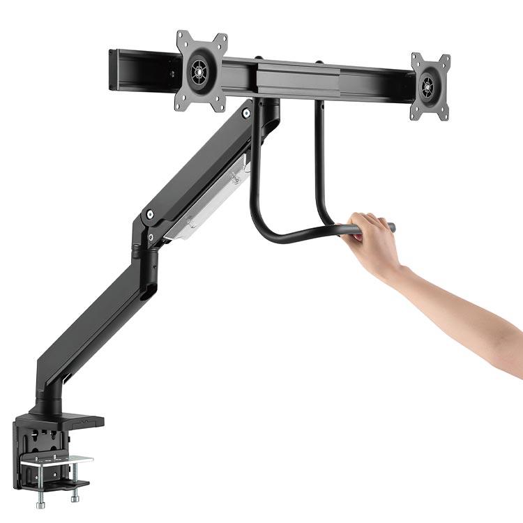 Using the handle to adjust the Echo Slide Dual Monitor Arm, shown in black.