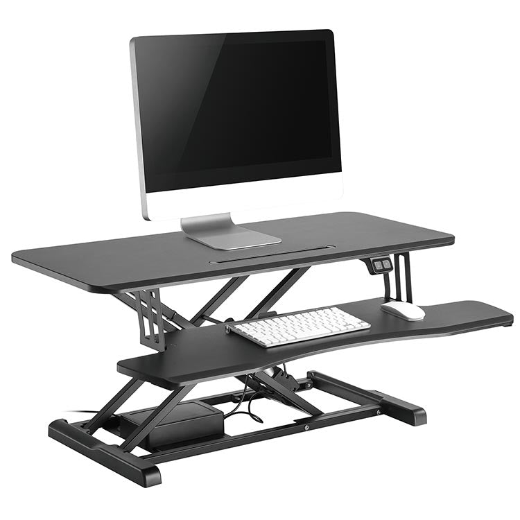 The Flexus E Electric Standing Desk Converter with computer, angle view.