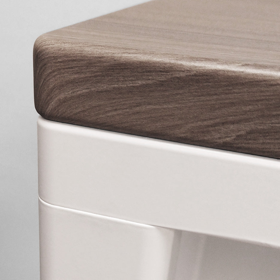 Close-up of the corner of a Q Desk, showing the ergo-contouring. Swiss Elm top on White base.