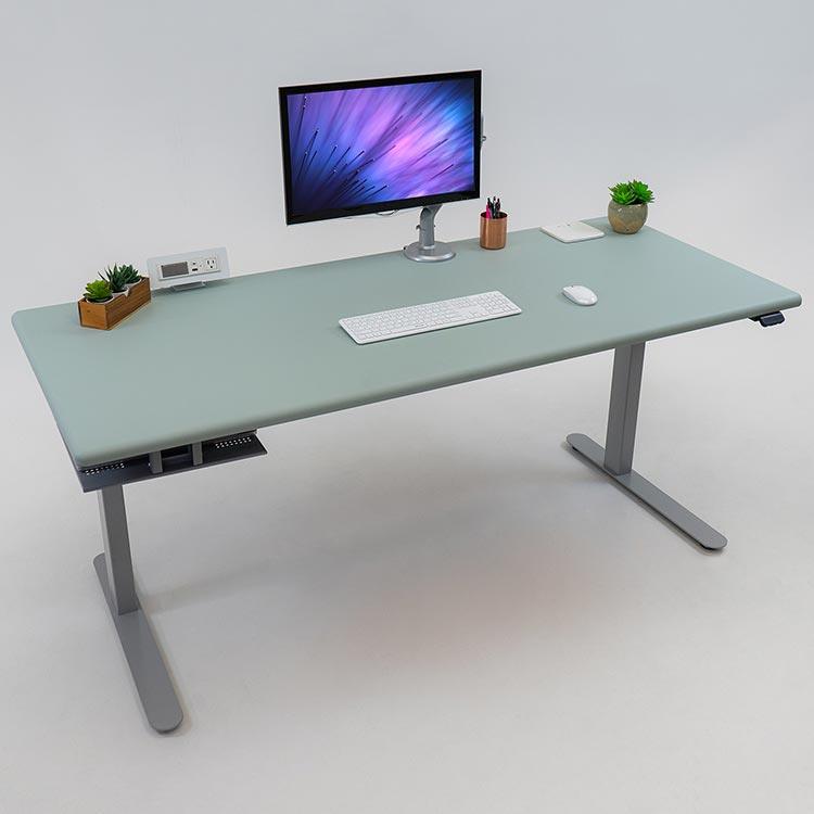 Lander Standing Desk with Luxe Sage top on Silver base, with Tech Dock installed on the underside of the desktop.